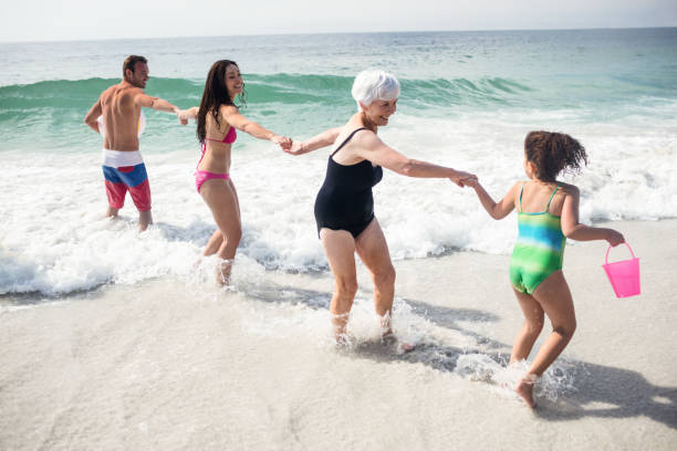 istock Happy family enjoying on beach 673096902
