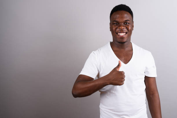 istock Studio shot of young African man against gray background 673097000