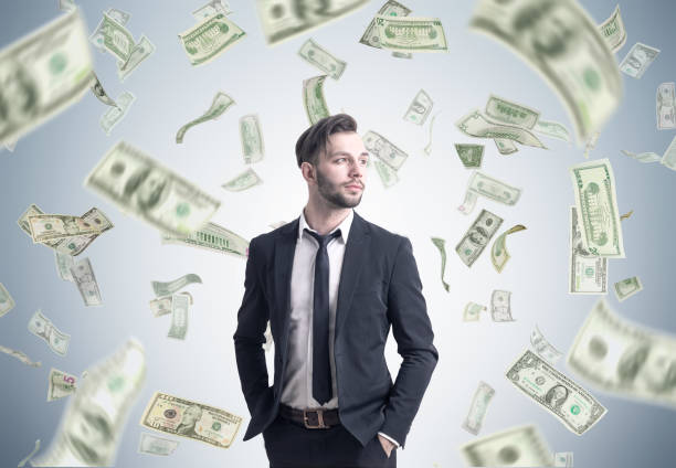 istock Bearded businessman and dollar rain 673097196