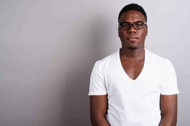 istock Studio shot of young African man against gray background 673097434