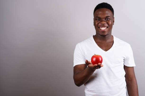 istock Studio shot of young African man against gray background 673097574