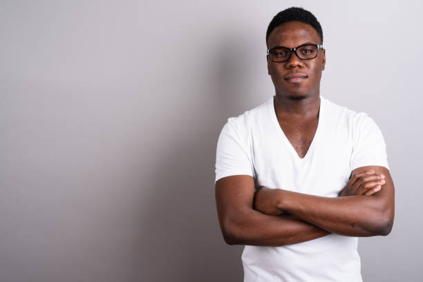 istock Studio shot of young African man against gray background 673097576