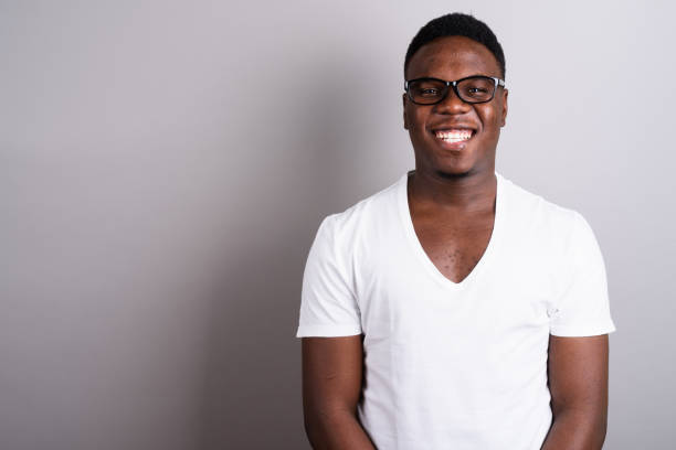 istock Studio shot of young African man against gray background 673097580