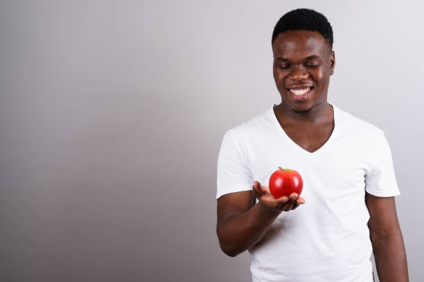 istock Studio shot of young African man against gray background 673097592