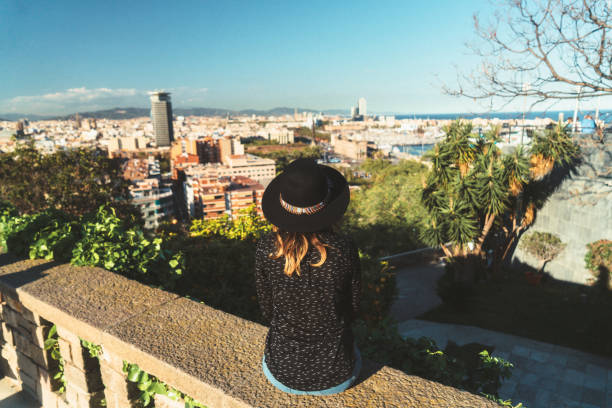 istock Woman looking at Barcelona cityscape 673104628