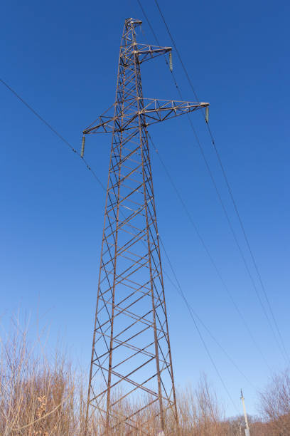 istock Concrete electric pole with wires against the sky 673105110