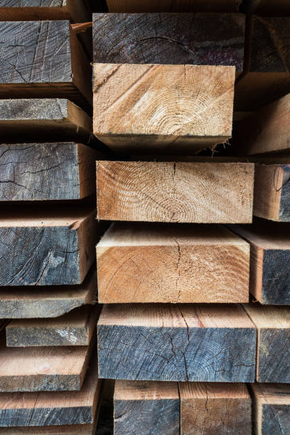 istock Stack of different size cut wood planks for building construction 673113694