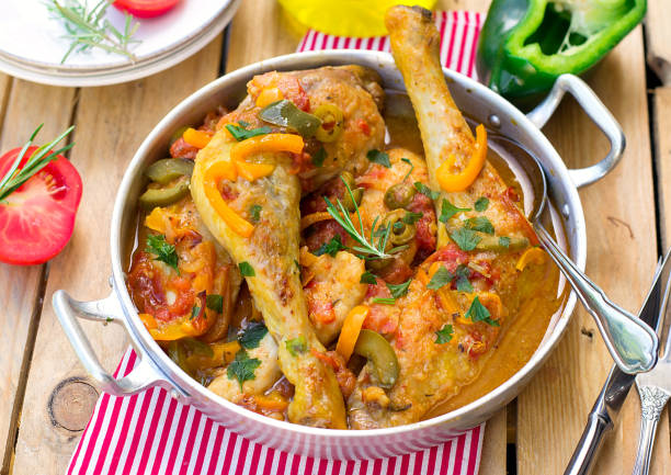 Basque style chicken basquaise with bell peppers, olives and tomatoes Basque style chicken basquaise with sweet peppers, olives and tomatoes french basque country photos stock pictures, royalty-free photos & images