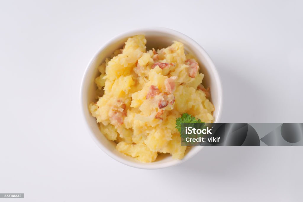 crushed potatoes with bacon bowl of crushed potatoes with bacon on white background Mashed Potatoes Stock Photo