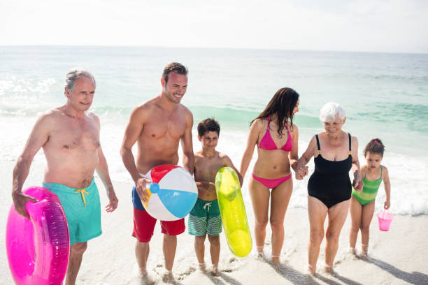istock Happy family enjoying on beach 673123558