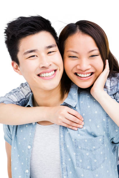 istock Young couple smiling at the camera 673123598