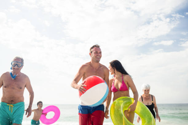 istock Happy family enjoying on beach 673123800