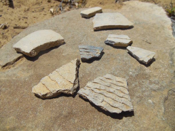 Prehistoric Pottery Fragments Prehistoric fragments of Ancestral Puebloan pottery, observed at Chaco Culture National Historic Park in New Mexico chaco culture national historic park stock pictures, royalty-free photos & images