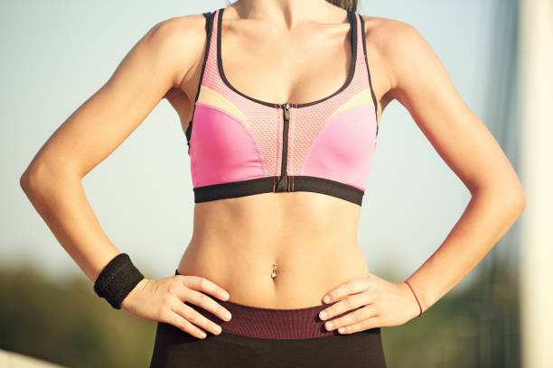 istock Sportive Young Woman Exercising on the Bridge 673127636