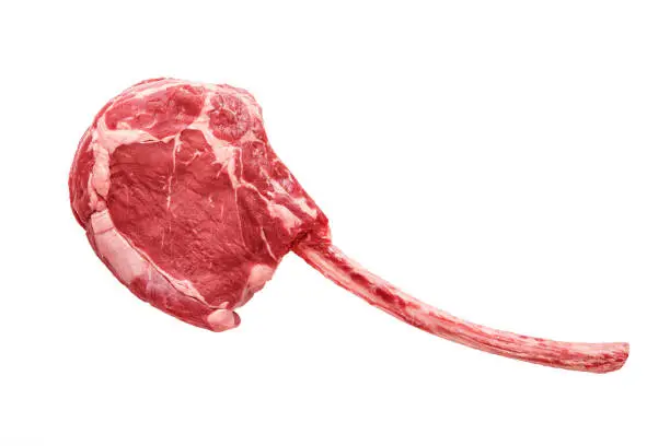 Raw dry aged tomahawk steak isolated on white