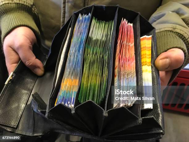 Man Holding A Full Wallet With Money Stock Photo - Download Image Now - Swiss Currency, Swiss Francs, Switzerland