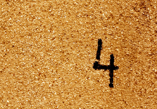 istock Number four on grungy orange cement wall. 673156056