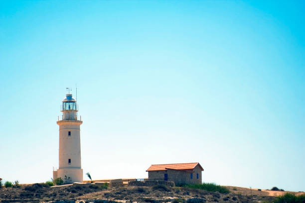 istock Lighthouse on beach in Paphos, Republic of Cyprus 673158636