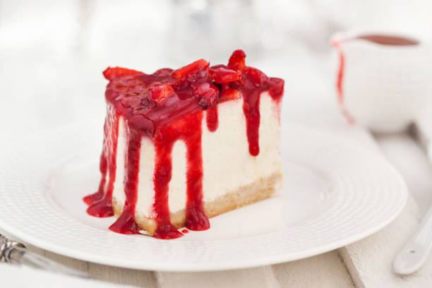 istock Delicious cheesecake decorated with berry sauce 673158802