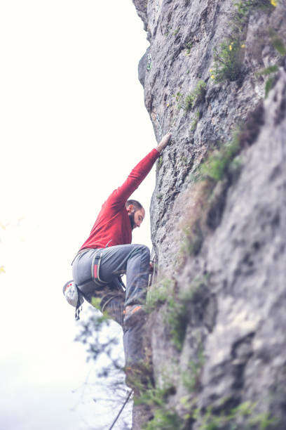 istock Handsome man climber on extreme terain in nature 673159200