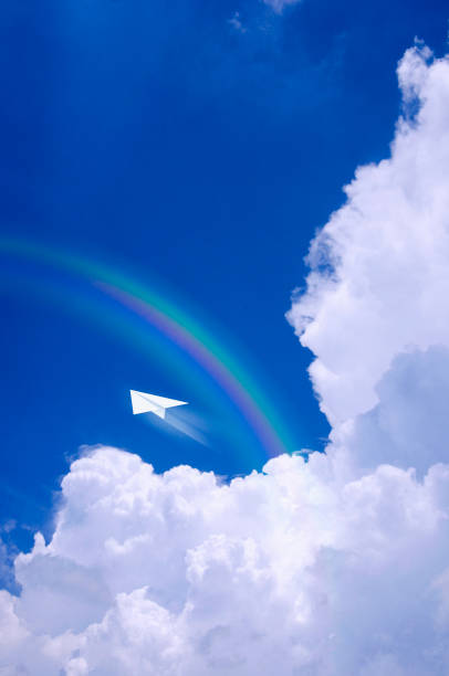 istock Towering cloud in summer and a paper airplane 673161744