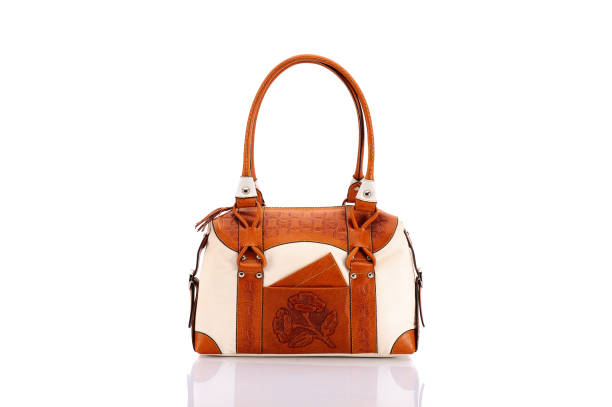 Leather ladies bag on a white background. Beautiful, fashionable, accessory, isolated. Interesting design, the texture of the skin. Comfortable handle.Leather ladies bag on a white background. Beautiful, fashionable, accessory, isolated. Interesting design, the texture of the skin. Comfortable handle.