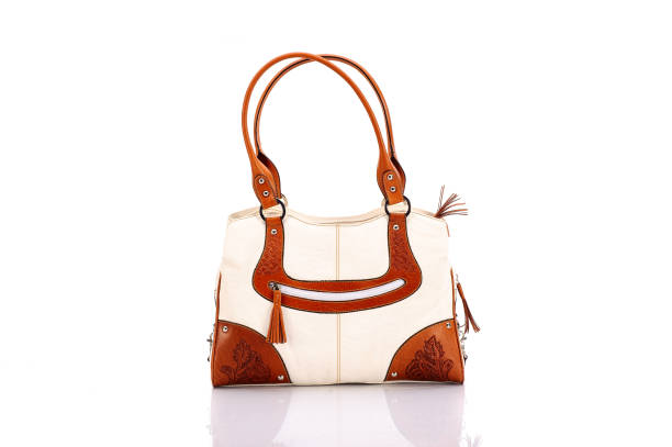 Bowling browm leather bag isolated on a white background. Women trendy bag.