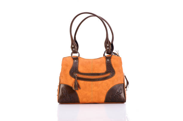 Leather ladies bag on a white background. Beautiful, fashionable, accessory, isolated. Interesting design, the texture of the skin. Comfortable handle.Leather ladies bag on a white background. Beautiful, fashionable, accessory, isolated. Interesting design, the texture of the skin. Comfortable handle.
