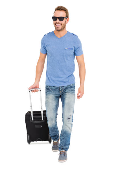 istock Happy young man with trolley bag 673173444