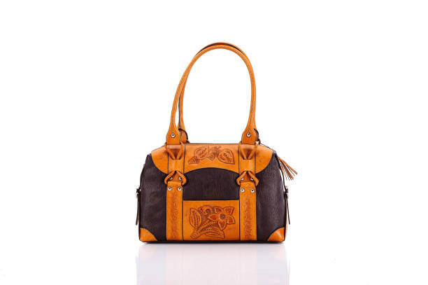 Leather ladies bag on a white background. Beautiful, fashionable, accessory, isolated. Interesting design, the texture of the skin. Comfortable handle.Leather ladies bag on a white background. Beautiful, fashionable, accessory, isolated. Interesting design, the texture of the skin. Comfortable handle.