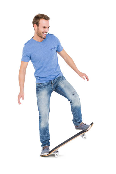 istock Happy young man skateboarding 673174056