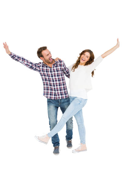 istock Young couple embracing and posing 673176398