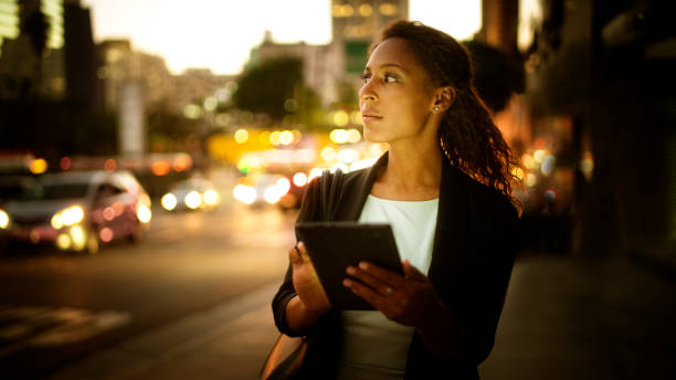 istock Digital tablet at night in the city. 673183328