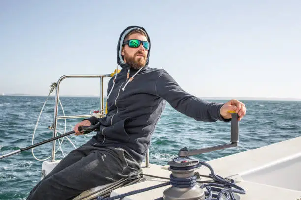 A Man Skipper sailing on Trimaran Boat