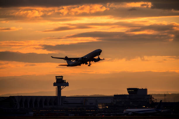 Silhouette of an airplane at sunset