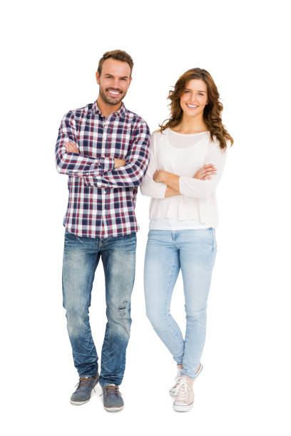 istock Happy couple standing with arms crossed 673196252
