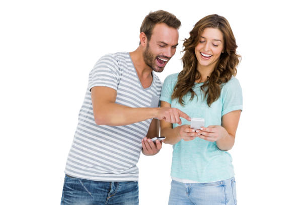 istock Happy young couple looking at mobile phone 673199942