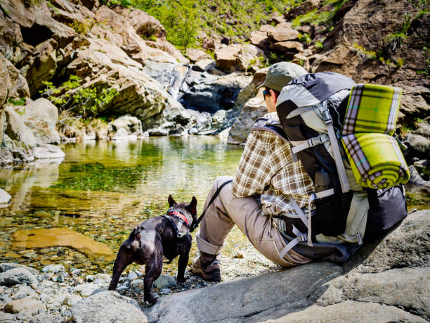istock Teeange boy hiking with his dog 673206902