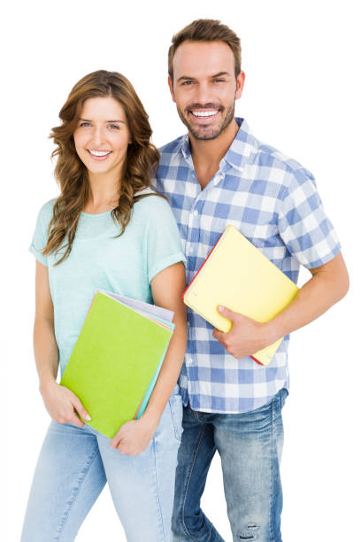 istock Happy young couple holding book and folder 673212824