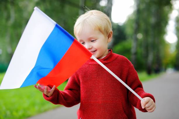 istock Toddler boy holding russian flag 673213118
