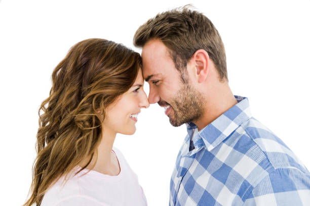 istock Happy young couple rubbing nose 673215850