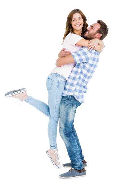 istock Happy young couple cuddling each other 673216360