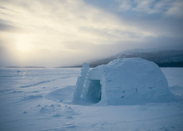 istock Isolated igloo a lake in winter before sunset in Yukon. Canada 673216728