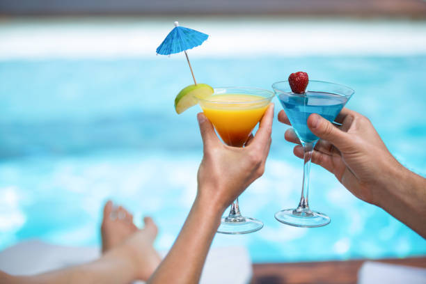 istock Hands of couple toasting martini glass 673219628
