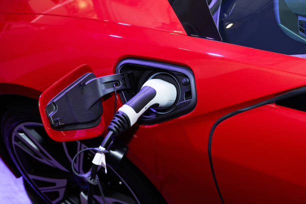 istock Charging an electric car with the power cable supply plugged in 673226464