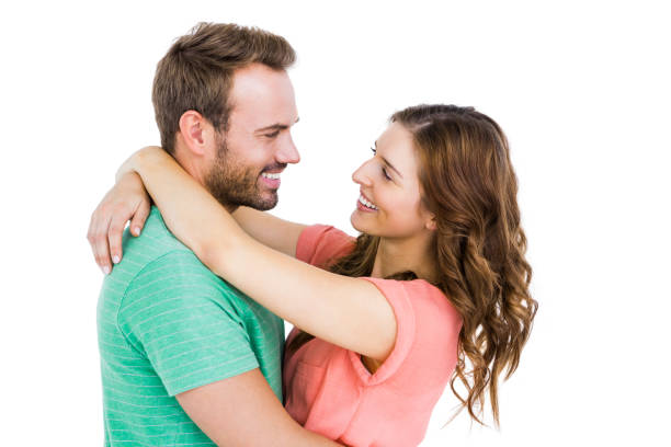 istock Happy young couple cuddling each other 673226612