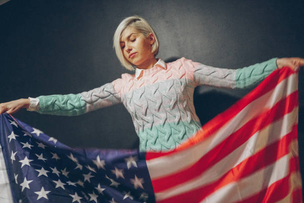 istock Blonde girl with USA flag 673232412