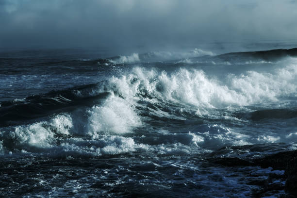 istock Big stormy ocean wave. Blue water background 673234312
