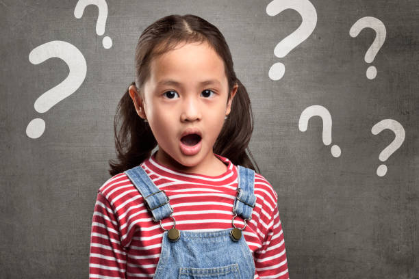 istock Cheerful asian child expression with question mark above her head 673234686