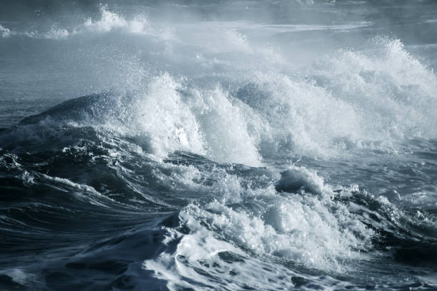istock Big stormy ocean wave. Blue water background 673237328